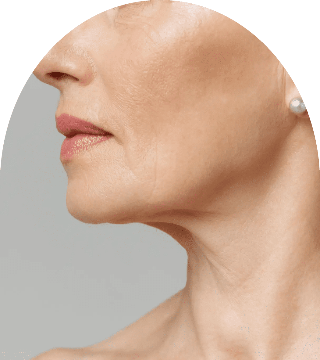 Woman's jawline and neck with pearl earring